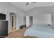 Bright and open main bedroom featuring a ceiling fan and access to a large walk-in closet at 3373 W Five Mile Peak Dr, San Tan Valley, AZ 85144
