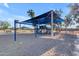 Community playground offers swings and slides for a safe, shaded recreational area for children and families in the neighborhood at 3373 W Five Mile Peak Dr, San Tan Valley, AZ 85144