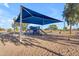 Community playground offers swings and slides for a safe, shaded recreational area for children and families in the neighborhood at 3373 W Five Mile Peak Dr, San Tan Valley, AZ 85144