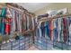Spacious walk-in closet offering custom shelving, plentiful storage space, and plenty of room for organization at 3373 W Five Mile Peak Dr, San Tan Valley, AZ 85144
