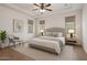 Bright bedroom featuring a plush bed, neutral decor, and plenty of natural light from the windows at 3438 W Little Hopi Dr, Phoenix, AZ 85086