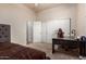 Bedroom featuring carpet, closet, desk and chair, all lit by natural light at 3438 W Little Hopi Dr, Phoenix, AZ 85086