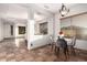 Inviting dining room with stylish chandelier and a marble-topped table, next to open floor plan at 3438 W Little Hopi Dr, Phoenix, AZ 85086