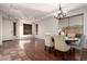 Bright dining room with a chandelier, ample natural light, wood floors, and stylish furnishings at 3438 W Little Hopi Dr, Phoenix, AZ 85086
