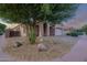 Inviting single-story home featuring desert landscaping, a spacious two-car garage, and unique rock features at 3438 W Little Hopi Dr, Phoenix, AZ 85086