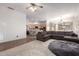 Spacious living room flows into the kitchen, featuring modern appliances and an open concept design at 3438 W Little Hopi Dr, Phoenix, AZ 85086
