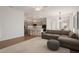 Spacious living room flows into the kitchen, featuring modern appliances and an open concept design at 3438 W Little Hopi Dr, Phoenix, AZ 85086