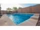Backyard pool with tiled edge, clear blue water, and outdoor space for recreation at 3438 W Little Hopi Dr, Phoenix, AZ 85086