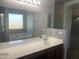 Bright bathroom with double sink vanity, shower and tub at 35743 W Cartegna Ln, Maricopa, AZ 85138