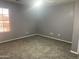 Clean bedroom with a window providing natural light at 35743 W Cartegna Ln, Maricopa, AZ 85138