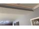Close-up of the ceiling with ambient lighting and decorative trim work at 35743 W Cartegna Ln, Maricopa, AZ 85138
