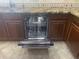 Stainless steel dishwasher installed in the kitchen with custom cabinetry at 35743 W Cartegna Ln, Maricopa, AZ 85138
