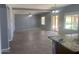Spacious living area with ceiling fan and sliding glass doors at 35743 W Cartegna Ln, Maricopa, AZ 85138