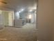 Spacious loft area with carpet flooring and natural lighting at 35743 W Cartegna Ln, Maricopa, AZ 85138