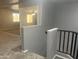 Loft area with a large window offering lots of natural light and a view to the living room at 35743 W Cartegna Ln, Maricopa, AZ 85138