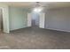 Spacious main bedroom boasts neutral carpet, fan, and is painted with light colors at 35743 W Cartegna Ln, Maricopa, AZ 85138