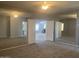 View of a main bedroom featuring a double door entryway and a mirrored wall at 35743 W Cartegna Ln, Maricopa, AZ 85138
