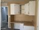 Office featuring built-in desk, cabinets, and carpet flooring at 35743 W Cartegna Ln, Maricopa, AZ 85138