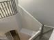 Staircase with railing and neutral paint at 35743 W Cartegna Ln, Maricopa, AZ 85138
