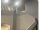 Modern staircase with gray walls, leading to the upper level of the home at 35743 W Cartegna Ln, Maricopa, AZ 85138