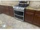 Stainless steel stove with double oven and gas cooktop installed in the kitchen at 35743 W Cartegna Ln, Maricopa, AZ 85138