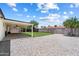 This backyard is spacious and includes a large covered patio at 3850 E Ludlow Dr, Phoenix, AZ 85032