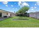 This backyard features a manicured lawn and small turf area for recreational activities at 3850 E Ludlow Dr, Phoenix, AZ 85032