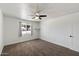 This bedroom features a modern ceiling fan and ample natural light at 3850 E Ludlow Dr, Phoenix, AZ 85032