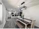 Dining room with updated light fixture and renovated kitchen at 3850 E Ludlow Dr, Phoenix, AZ 85032