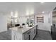 Renovated kitchen with quartz countertops, stainless steel appliances and view of the dining room at 3850 E Ludlow Dr, Phoenix, AZ 85032