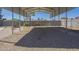 Spacious gravel backyard with a covered parking area is perfect for outdoor living and entertaining at 4025 E Surrey Ave, Phoenix, AZ 85032