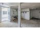 Unfinished basement with wood floor and a vintage desk covered in stickers, ready to be transformed into a living area at 4025 E Surrey Ave, Phoenix, AZ 85032