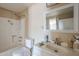 Bright bathroom featuring a shower, tub, and a white vanity with a sink at 4025 E Surrey Ave, Phoenix, AZ 85032