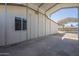 Long carport provides ample covered parking, protecting vehicles from the elements with a large space at 4025 E Surrey Ave, Phoenix, AZ 85032