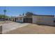 Cozy single-story home with an open driveway and a partially xeriscaped front yard at 4025 E Surrey Ave, Phoenix, AZ 85032