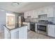 Well-appointed kitchen with an island, stainless steel appliances, and plenty of cabinet space at 4025 E Surrey Ave, Phoenix, AZ 85032