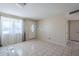 Bright living room with tile floors, a large front window, and neutral paint, ready for personal touches at 4025 E Surrey Ave, Phoenix, AZ 85032