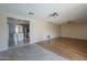 Open concept living room flowing into the kitchen with stainless steel appliances at 4025 E Surrey Ave, Phoenix, AZ 85032