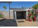Outdoor storage shed with colorful flowers provides utility and charm in the desert landscape at 4025 E Surrey Ave, Phoenix, AZ 85032