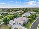 Expansive aerial view of an estate home with a pool, lush landscaping, and a view of the mountains in the distance at 4040 E Mclellan Rd # 16, Mesa, AZ 85205
