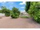 Spacious backyard with lush greenery and a view of the sparkling pool, perfect for relaxation and entertainment at 4040 E Mclellan Rd # 16, Mesa, AZ 85205