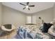 Inviting bedroom with ceiling fan, wood-look tile flooring, and neutral decor at 4040 E Mclellan Rd # 16, Mesa, AZ 85205