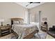 Comfortable bedroom featuring a ceiling fan, window with blinds, and a fun, patterned bedspread at 4040 E Mclellan Rd # 16, Mesa, AZ 85205