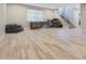 Bright bonus room with wood-look tile flooring, desk, and comfortable chair at 4040 E Mclellan Rd # 16, Mesa, AZ 85205