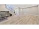 Spacious bonus room with wood-look tile, staircase, and abundant natural light at 4040 E Mclellan Rd # 16, Mesa, AZ 85205