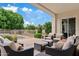 Relaxing covered patio with comfortable seating overlooking the sparkling pool and lush backyard at 4040 E Mclellan Rd # 16, Mesa, AZ 85205