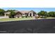 Inviting single-story brick home with well-maintained lawn and mature landscaping at 4040 E Mclellan Rd # 16, Mesa, AZ 85205