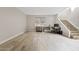 Spacious flex space featuring wood-look tile floors, room for office and play area, and convenient stairs at 4040 E Mclellan Rd # 16, Mesa, AZ 85205