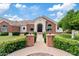 Charming front entrance featuring a brick pathway, manicured landscaping, a decorative door with sidelights, and exterior lanterns at 4040 E Mclellan Rd # 16, Mesa, AZ 85205