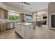 Open kitchen with a center island, wood floors, and views of the living and dining areas at 4040 E Mclellan Rd # 16, Mesa, AZ 85205